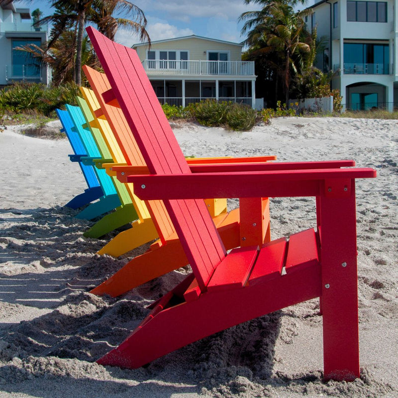 Multiple colors of Berlin Gardens Adirondack chairs on the beach