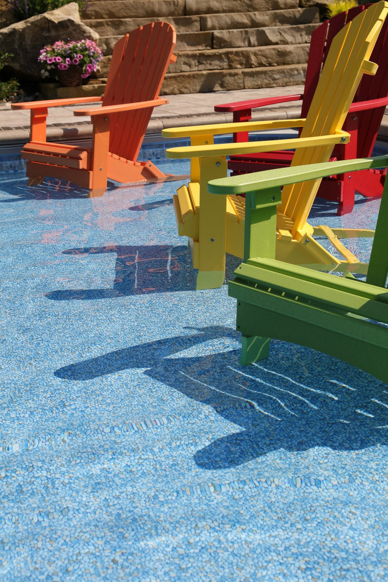 Berlin Gardens Comfo Back Folding Adirondack Chair in a pool